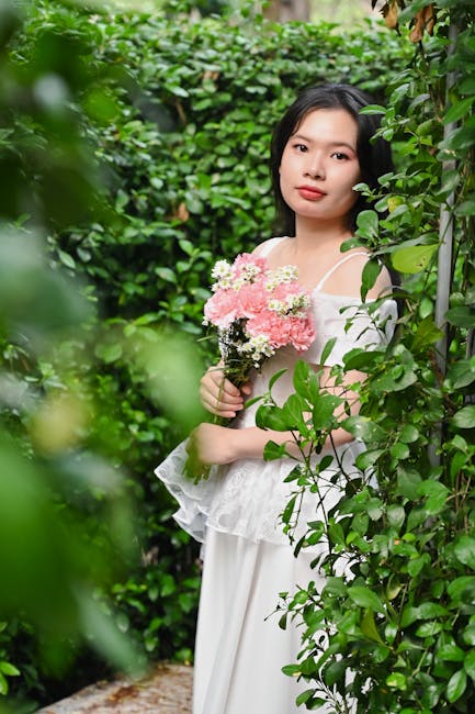 Elegant woman with flowers in a garden